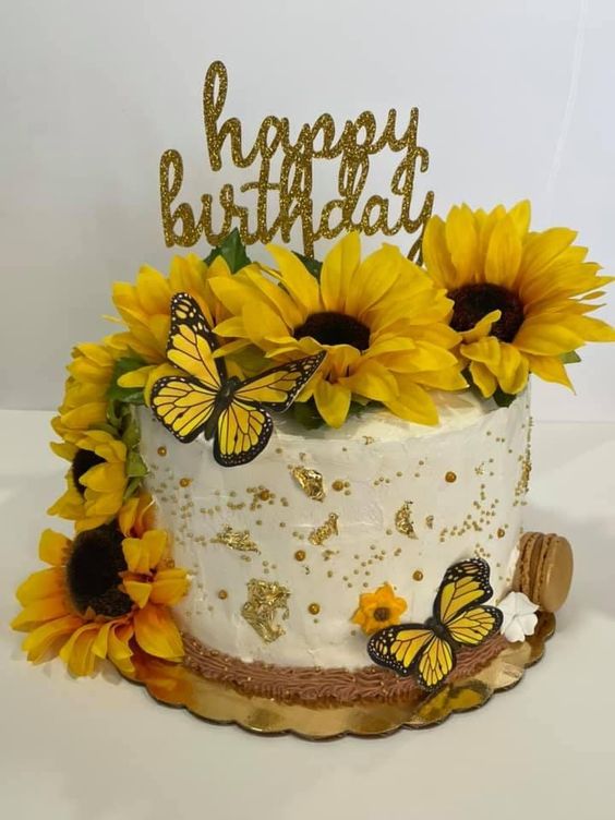 sunflowers in a vase with birthday cake