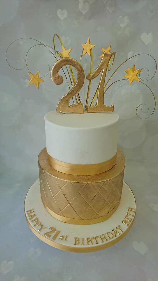 elegant white and gold birthday cake