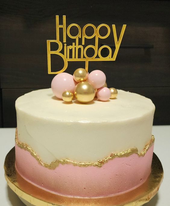 pink and gold first birthday cake