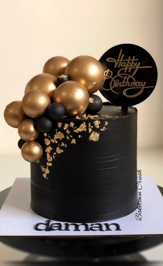 simple black and gold birthday cake